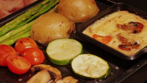 french swiss or spanish restaurant with traditional tapas food, spanish cuisine, delicious tapas and cheese plate, bruschetta with cheese, olives dry tomatoes and tasty sandwich bar appetizer, buffet