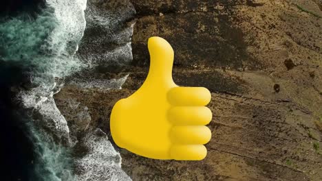 digital composition of thumbs up icon against aerial view of the sea waves