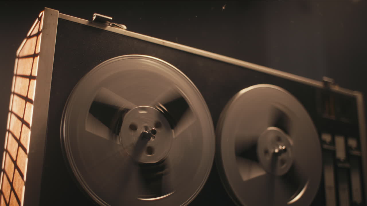 A vintage tape recorder in a pulsing light