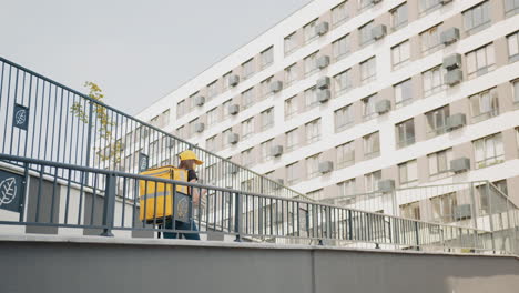 delivery person walking to apartment building