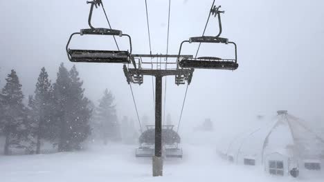 empty ski chairlifts in a heavy blizzard snowstorm in mammoth, ca