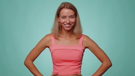 woman pointing to camera and looking with playful happy expression, making choice, showing direction