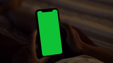 holding and single tapping a green screen iphone