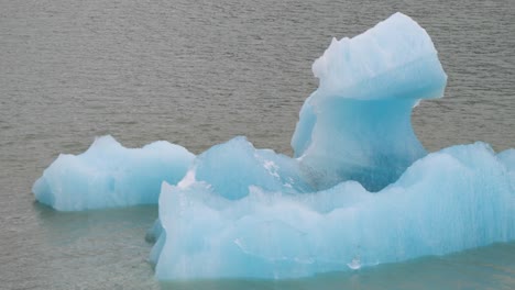 big iceberg floating at endicott arm fjord, dawes glacier. climate change affecting the glaciers of alaska.