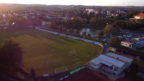 People-Play-Soccer-Game-At-An-Outdoor-Pitch-In-Zistersdorf-Town,-Austria