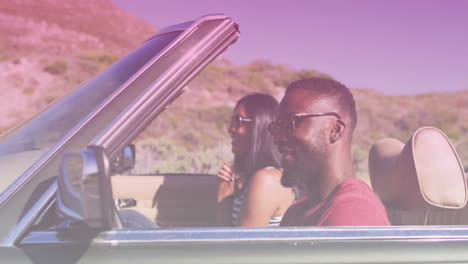 animation of light shade over biracial couple driving car at seaside