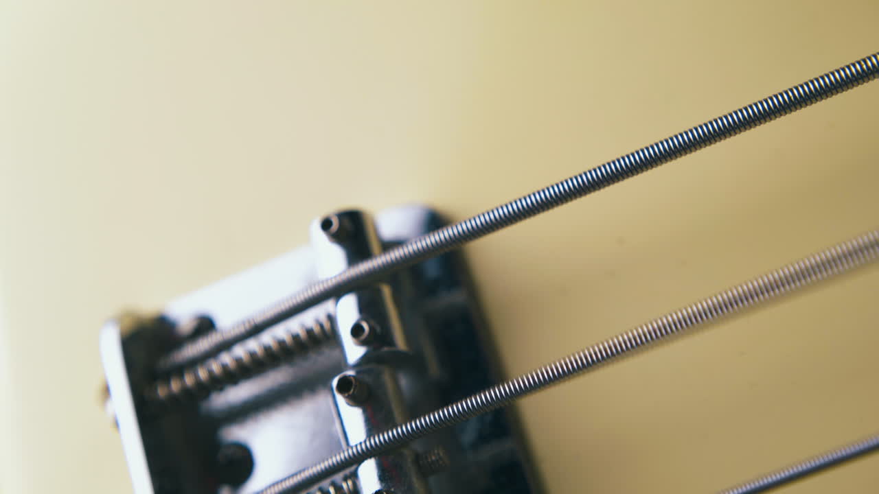 modern stainless steel guitar string moves by silver bridge