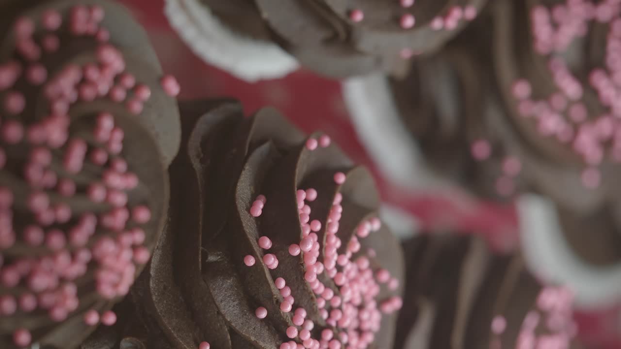 Close-up of Chocolate Cupcakes with Pink Sprinkles