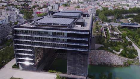 aerial view of port marianne with rotating shot of montpellier city hall