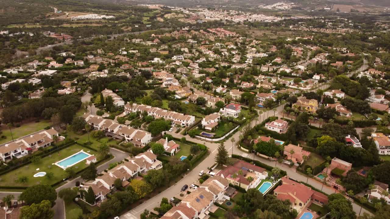 Top down aerial view Spanish town surrounded by nature and countryside