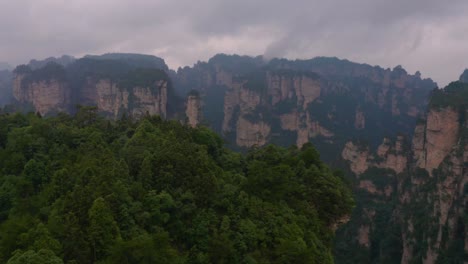 Drone-shot-of-Zhangjiajie-national-park-in-China,-karst-mountains-all-over-the-place