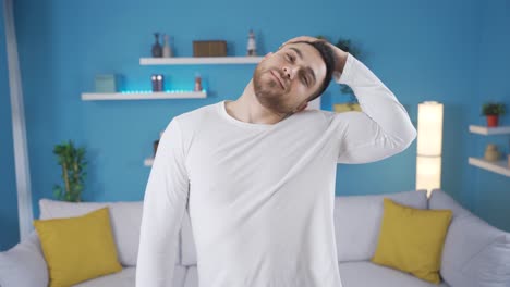 Young-athletic-man-doing-stretching-exercises-looking-at-camera.