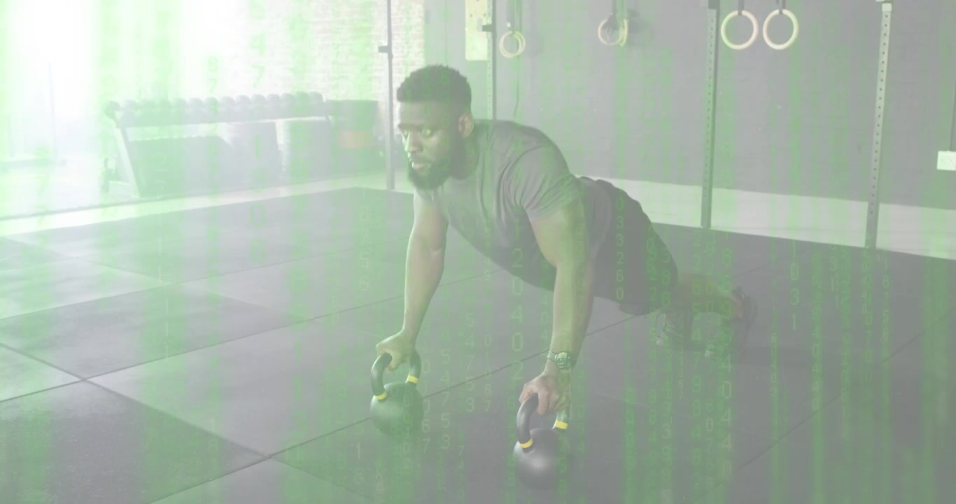 Man gripping kettlebell handles initiating push-up reps on gym floor boosting strength training