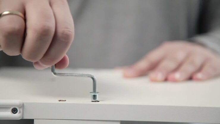 Assembling Furniture with Screwdriver and Hex Key