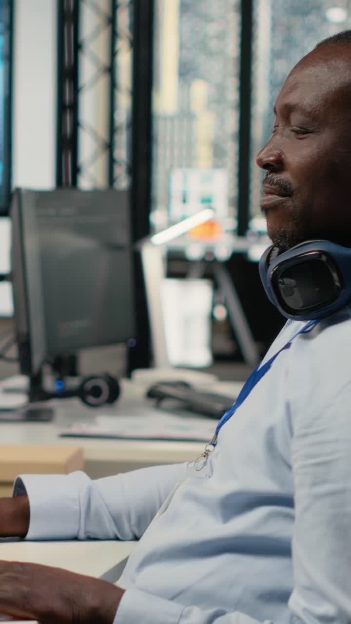 Vertical video Data scientist in office doing software development to launch new features