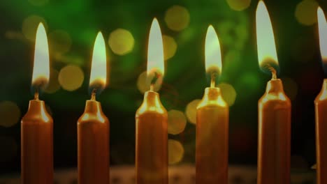 animation of lit candles with flickering spots of light