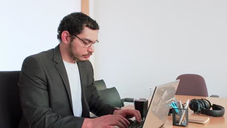 man using laptop: digital workflow - side