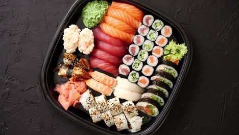 various kinds of sushi on plate or platter set