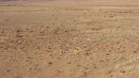 Aerial-view-of-a-target-board-on-a-remote-western-landscape-in-Norwood,-Colorado