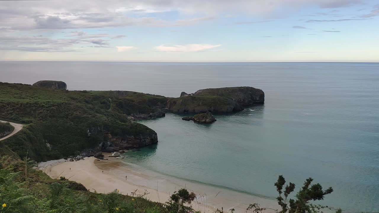 Peaceful ocean view from a hill near Torimbia beach in Asturias, Spain