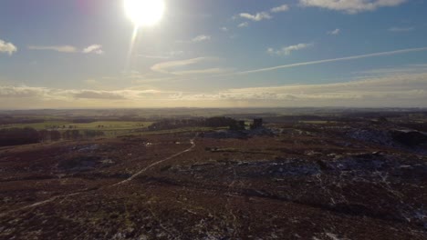 sun-drenched flyover rothley castle, northumberland. dolly shot.