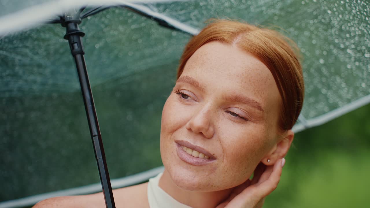Woman under a rain umbrella