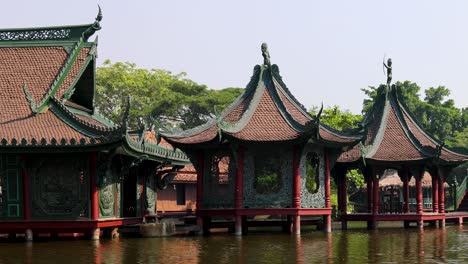 peaceful view of an asian-style pavilion over water