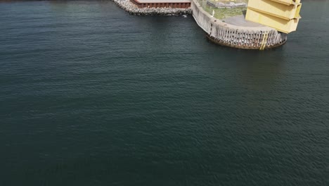 old-boat-in-the-harbor-near-a-big-bridge-over-the-sea