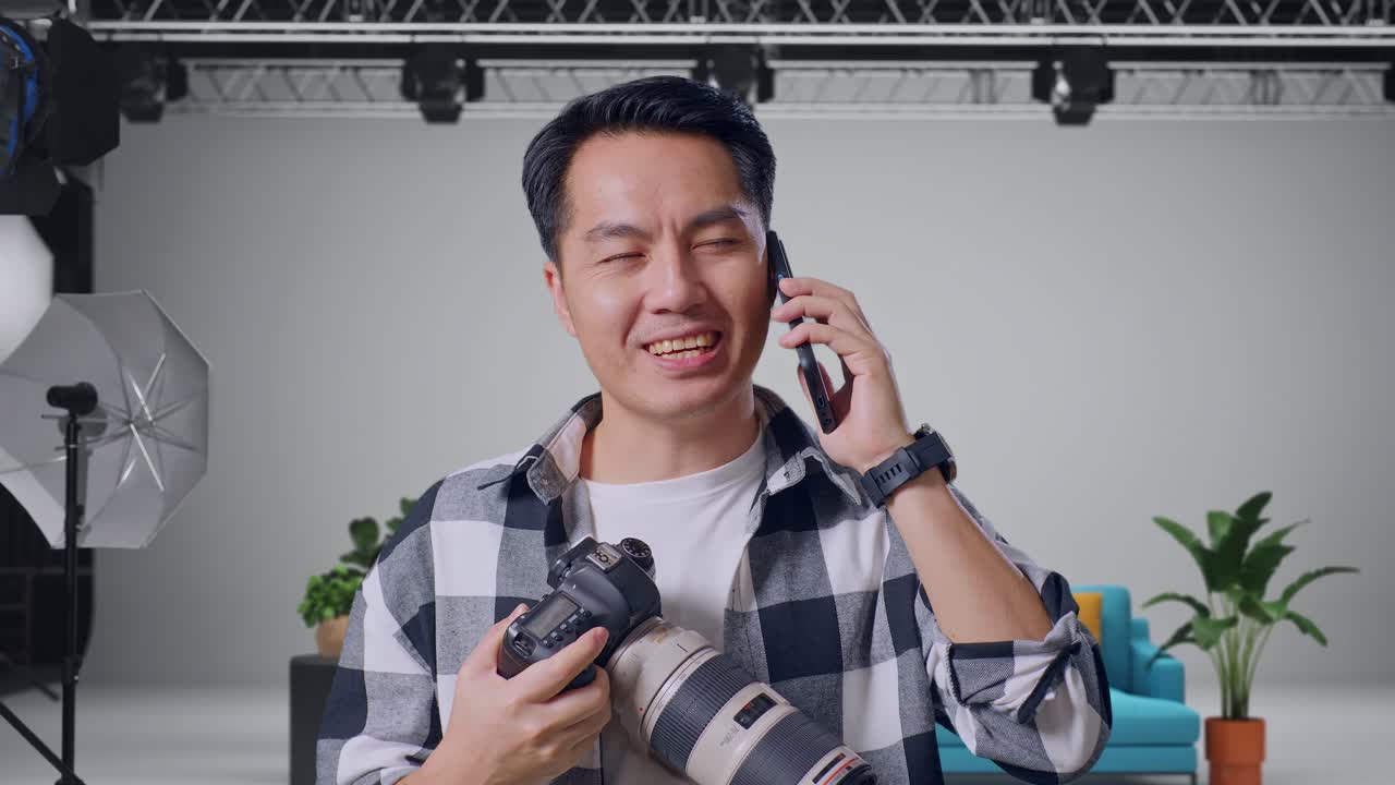 Photographer Talking on the Phone in a Studio