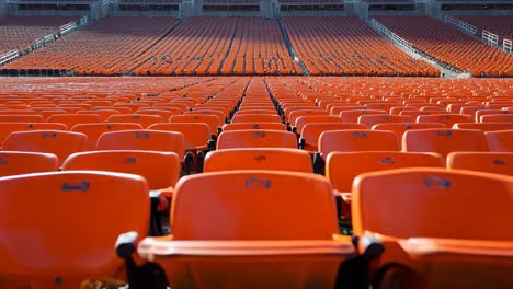 Empty Orange Seats in a Stadium