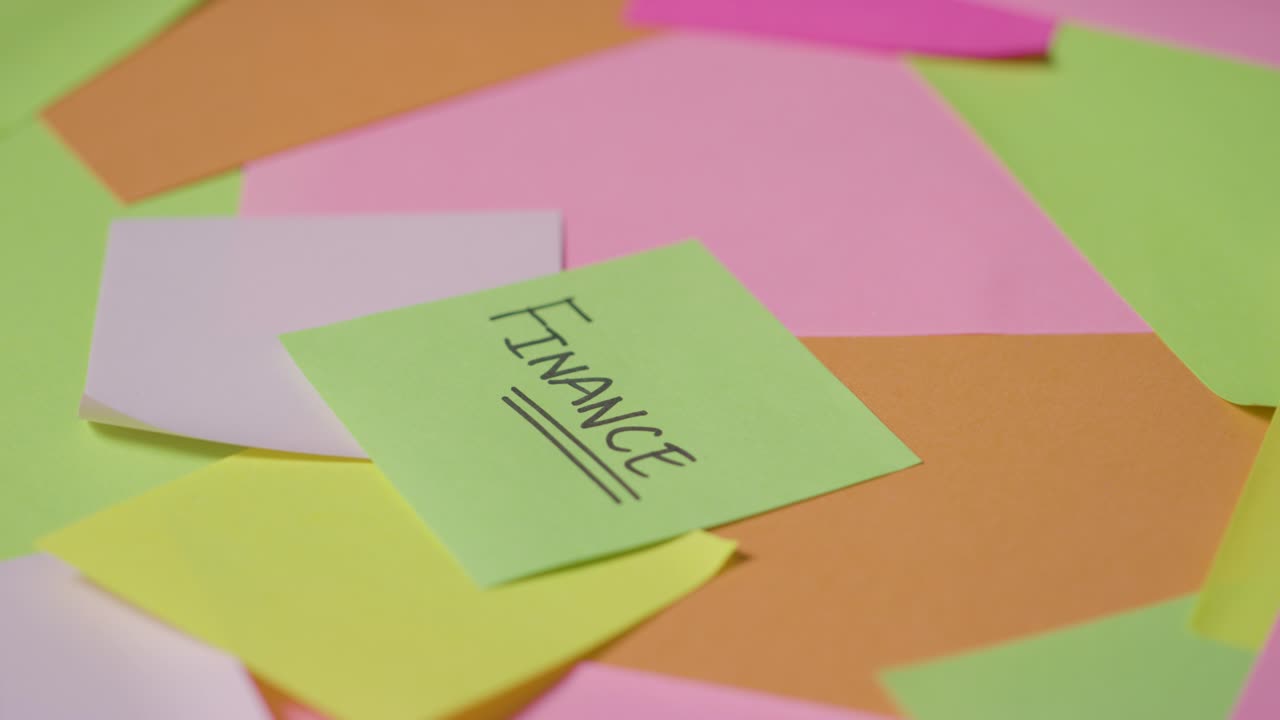 Business Concept Of Revolving Sticky Notes With Finance Written On Top Note 1