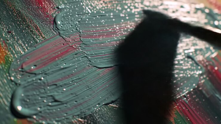 Artistic Brushstrokes on Canvas: A Close-Up View of Vibrant Paint Application Captured in Moving Frames, Highlighting the Textures and Colors of Creative Expression