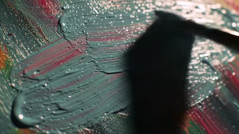 artistic brushstrokes on canvas: a close-up view of vibrant paint application captured in moving frames, highlighting the textures and colors of creative expression
