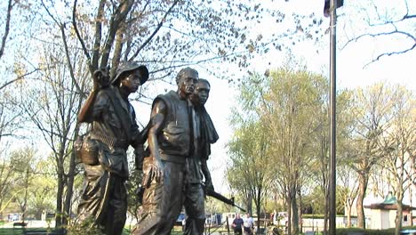 a panup to a united states flag from the three soldiers sculpture in washington dc