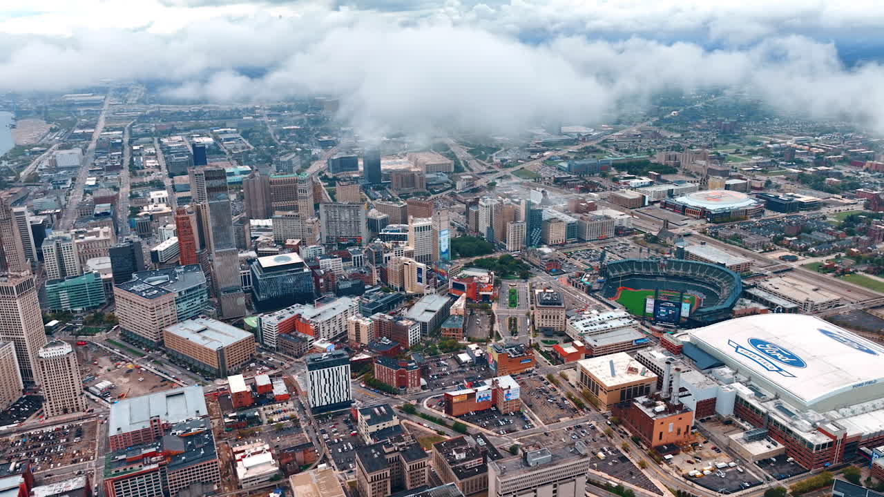 Detroit, USA, 28 July 2025: Detroit Downtown Core with Sports Stadiums Under Low Clouds. An aerial view captures the Detroit downtown