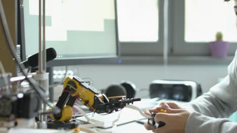 students using a 3d printer in the lab