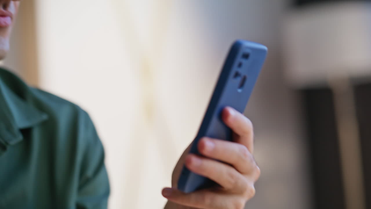 Businessman making payment mobile phone shopping online in office space closeup