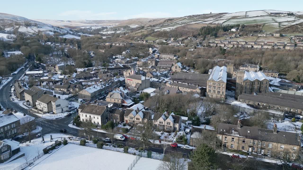 Winter Cinematic Cityscape Townscape with snow covered roof tops Panorama 4K Marsden Village West Yorkshire, Endland
