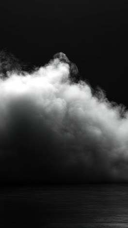 clouds over calm water. thick, dark clouds roll over a calm, reflective surface, creating a moody atmosphere during dusk.