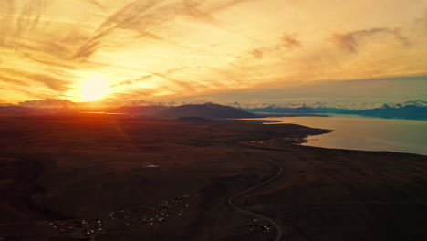 Beautiful Sunset over El Calafate near Santa Cruz in Patagonia, Argentina.Aerial Drone View of Colorful Warm Sky as the Sun Sets over the Patagonian Steppe and the Andes Mountains