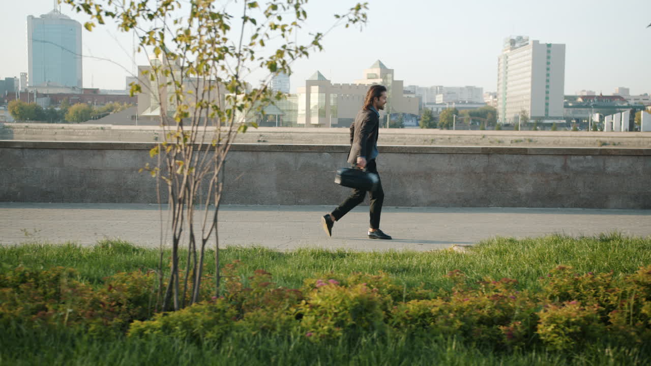 Businessman Walking in City Park