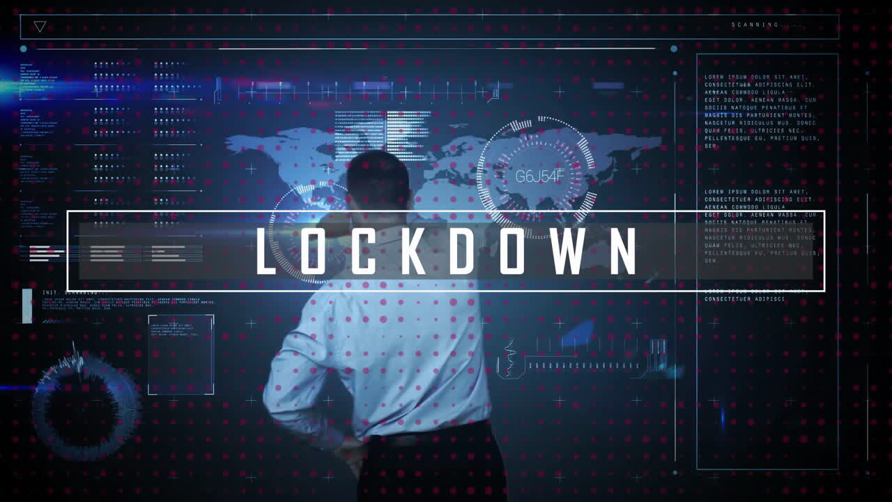 Animation of lockdown text over caucasian businessman using digital screen