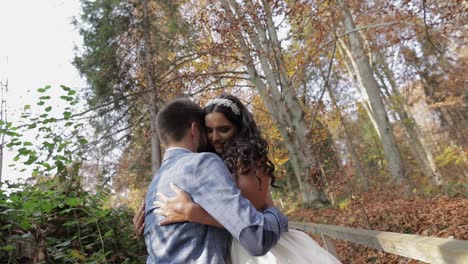 Groom-with-bride-near-mountain-hills-in-the-forest.-Couple.-Making-a-kiss