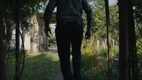 man walking in a garden