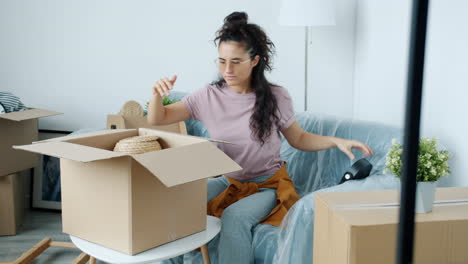 woman unpacking boxes in a new home