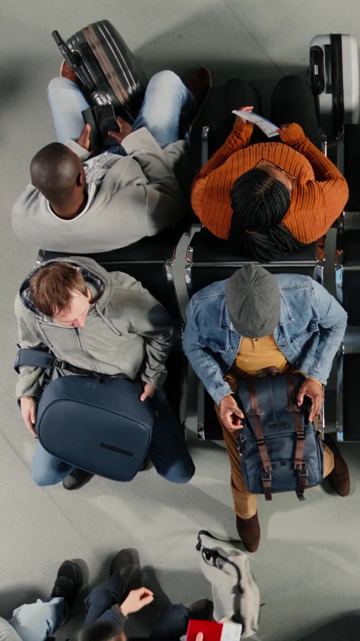 Top View of Passengers Arriving and Sitting in Airport Waiting Area