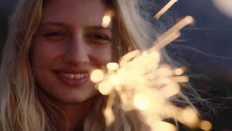 portrait happy woman playing with sparklers celebrating new years eve enjoying independence day celebration at sunset