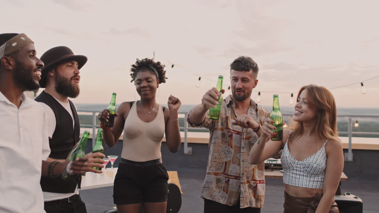 Group of Happy Friends Toasting at Rooftop Party