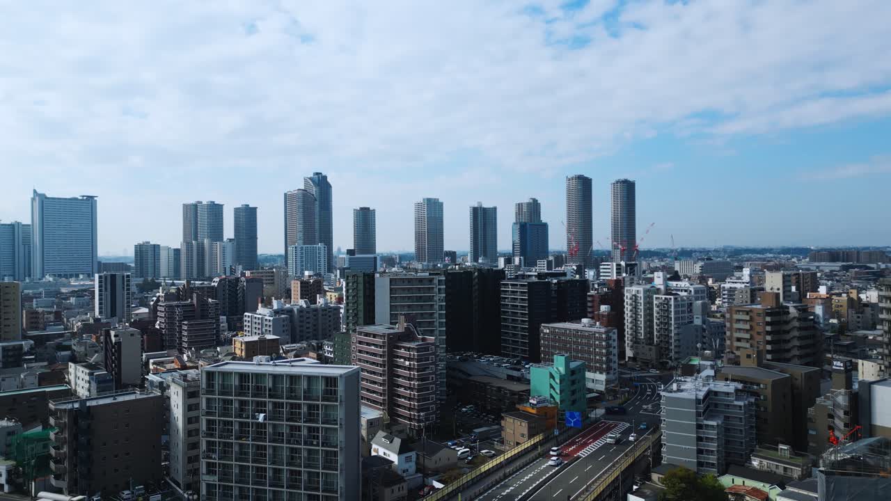 Establishing aerial shot of Musashi Kosugi’s futuristic urban design