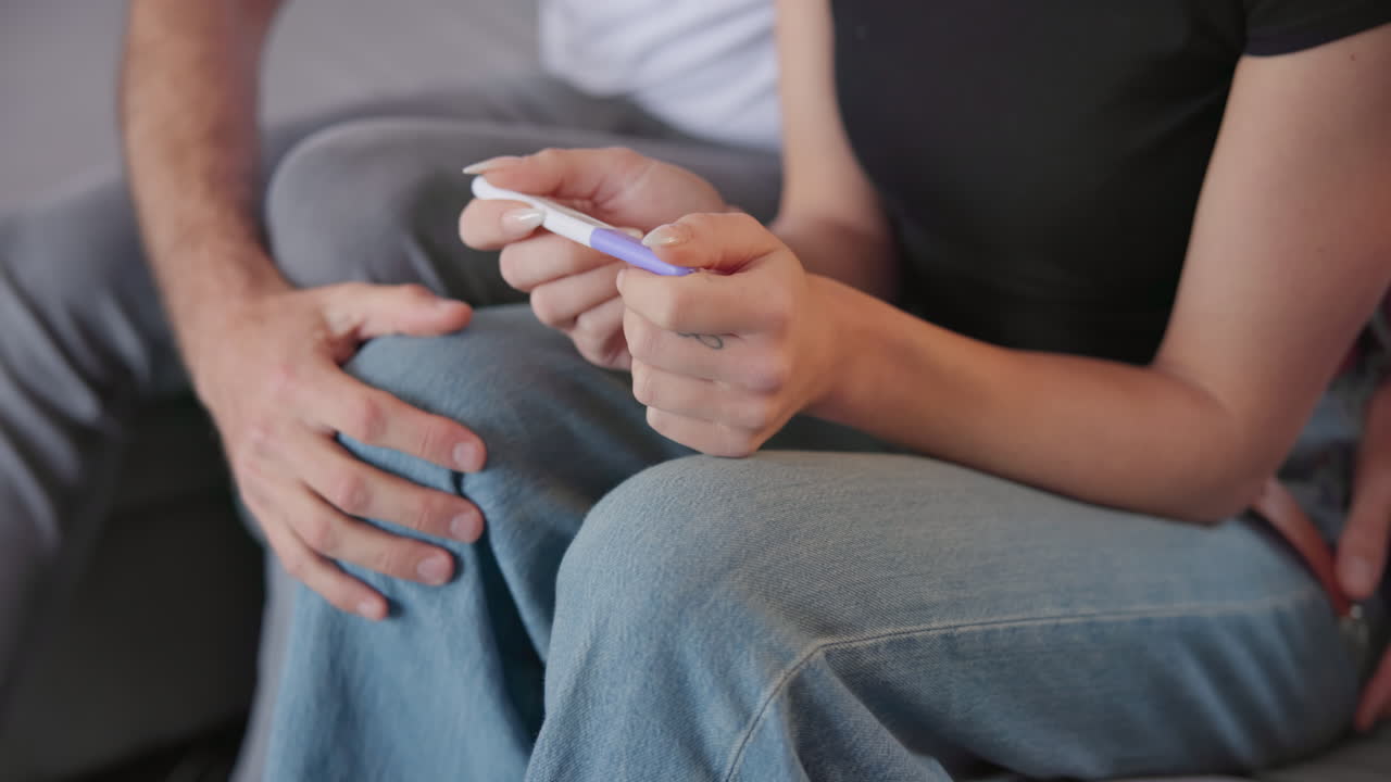 Love, hands and a couple with pregnancy test